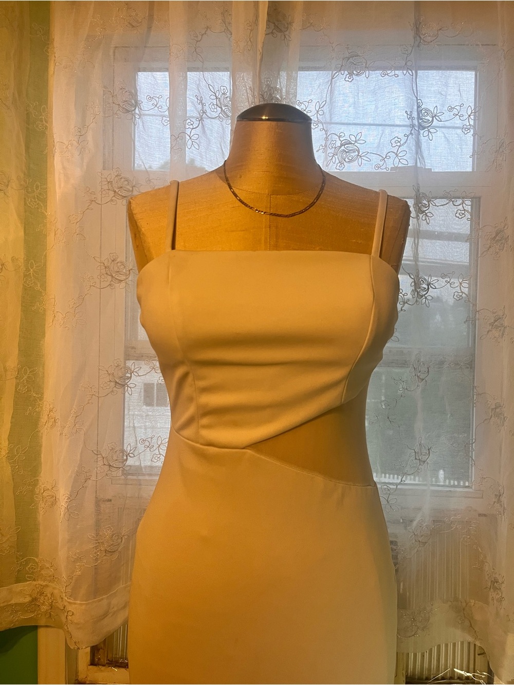 White satin dress with a side cutout